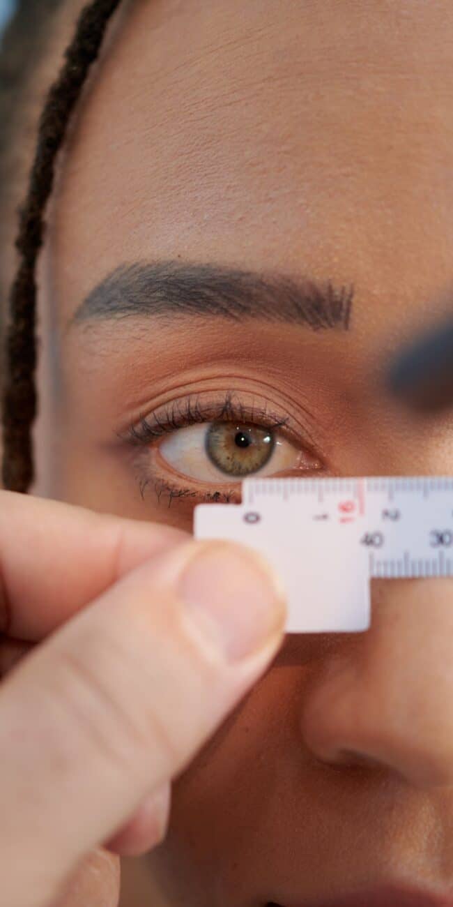 Doctor Measuring Distance Between Eyes